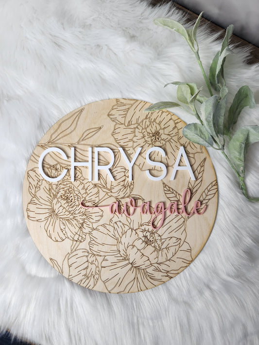 Nursery name sign with floral background