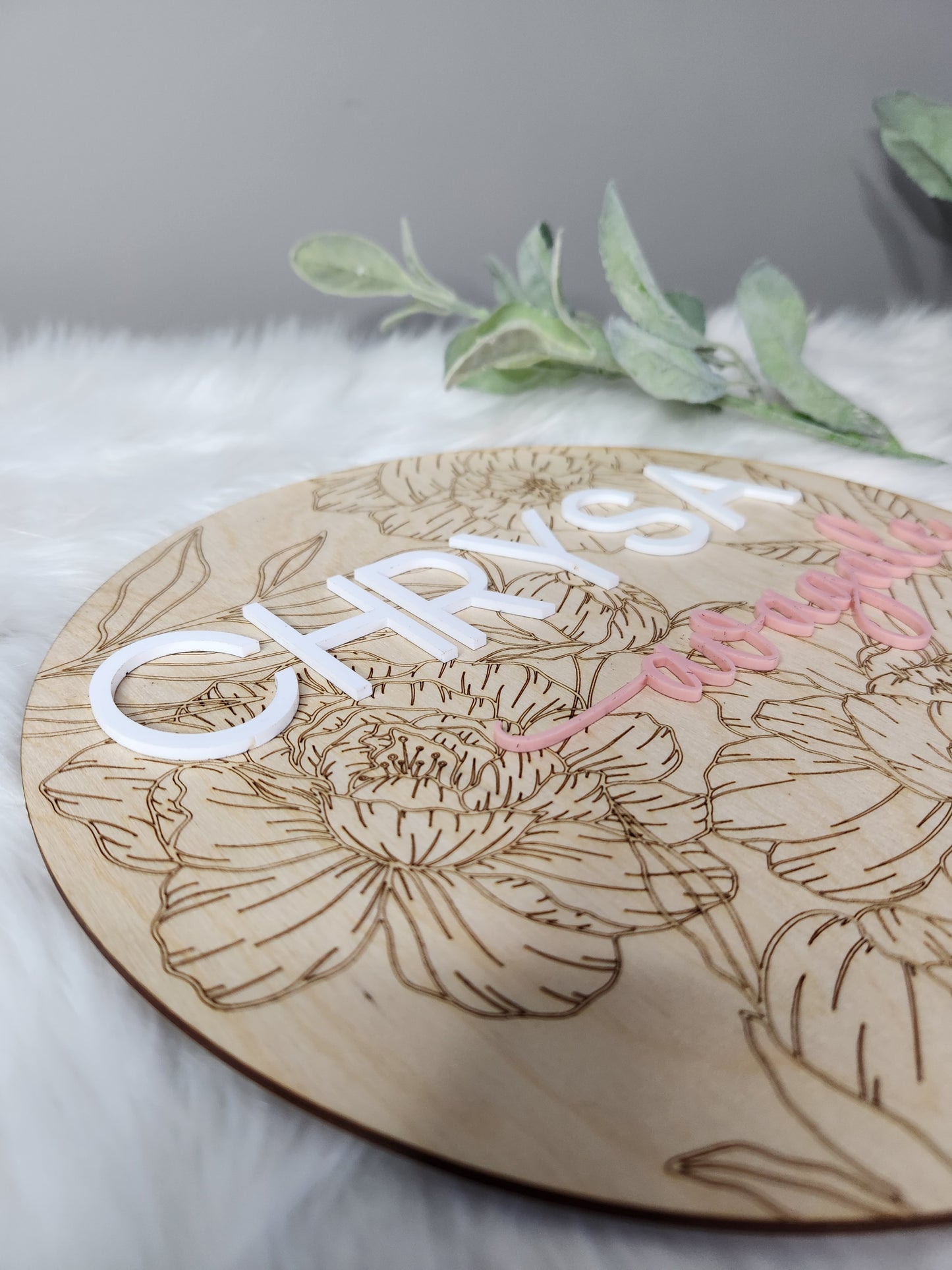 Nursery name sign with floral background